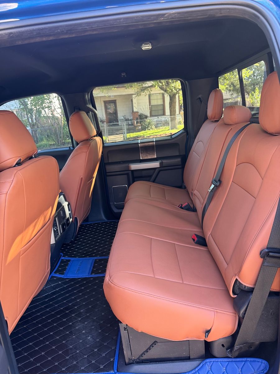 Tan rear bench seat cover in a truck