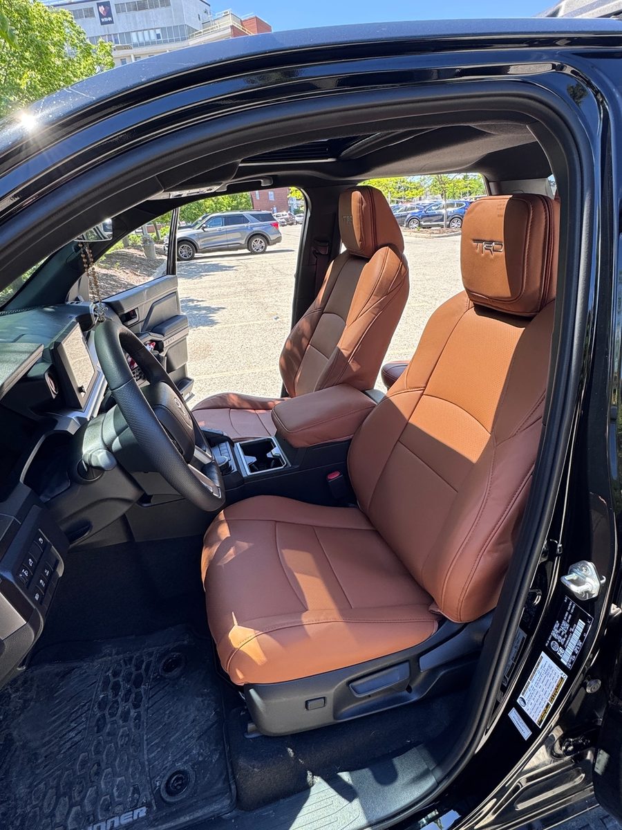 Saddle brown front seat covers in a Toyota