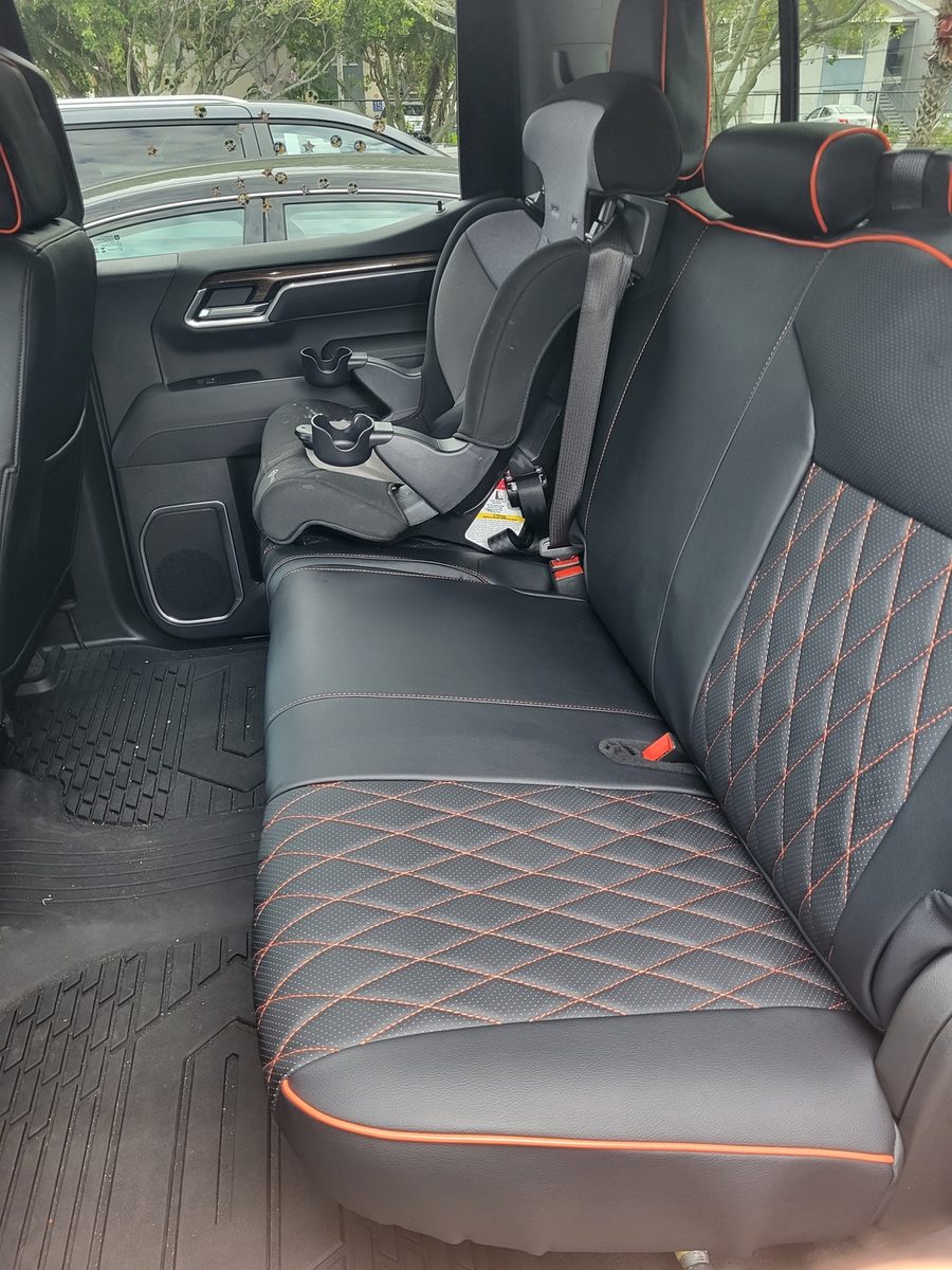 Black diamond rear bench seat cover with orange stitching