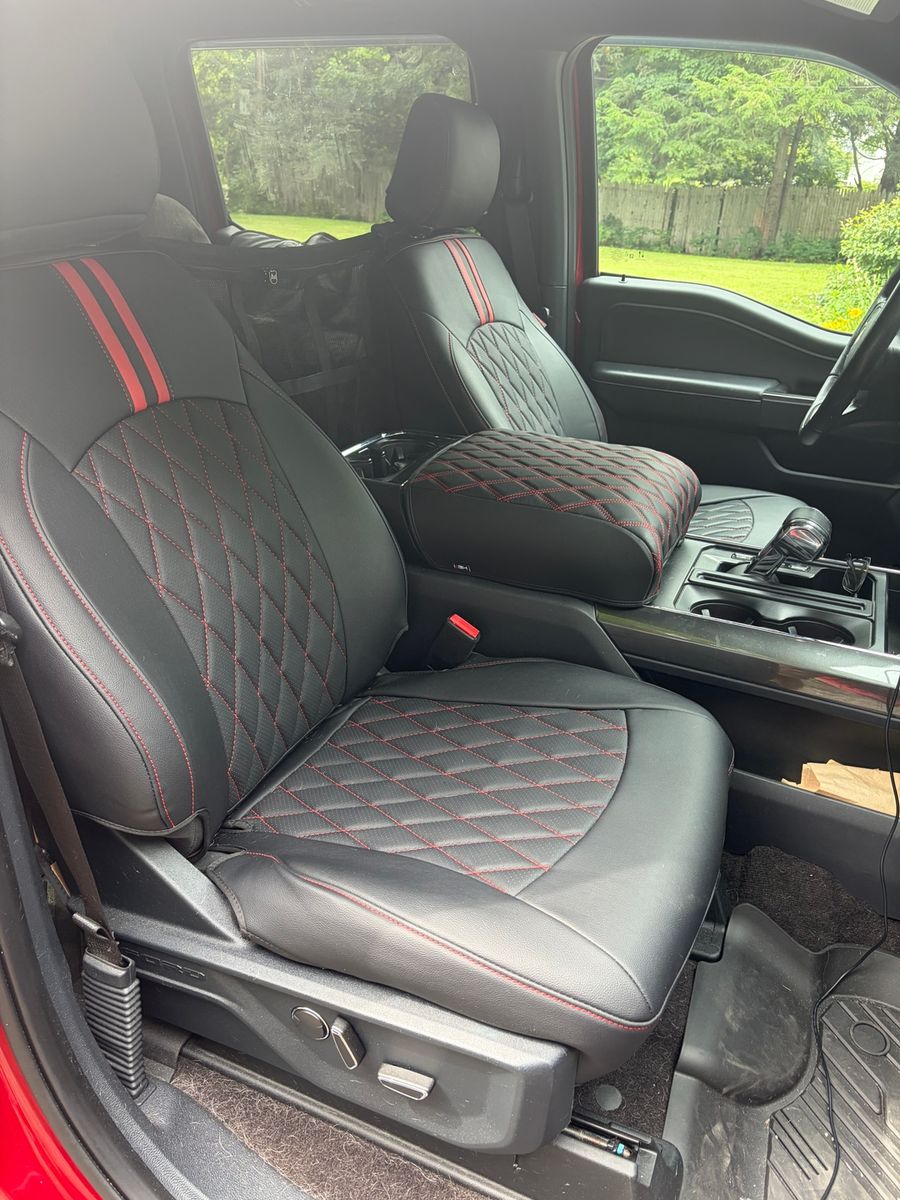 Black seat covers with a red stripe