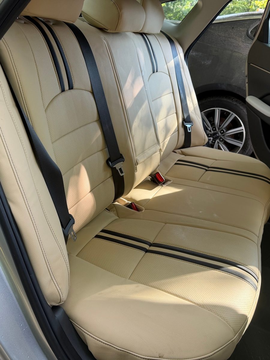 Beige rear seat covers with black stripes