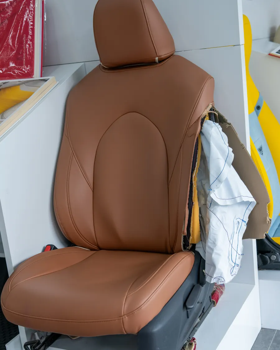 A finished tan seat cover fitted on a seat for checking